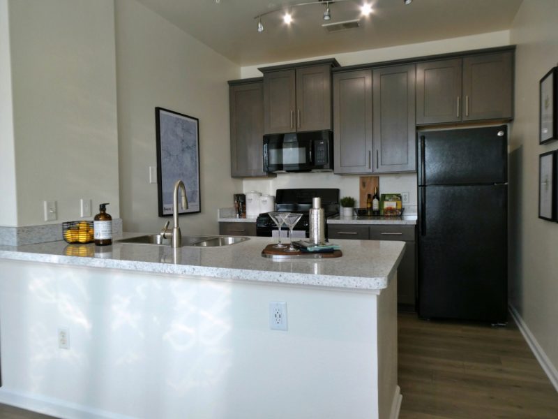 This image shows the Premium Apartment Feature, especially the kitchen island showcasing different kitchen pieces of equipment that is ideal for every resident.